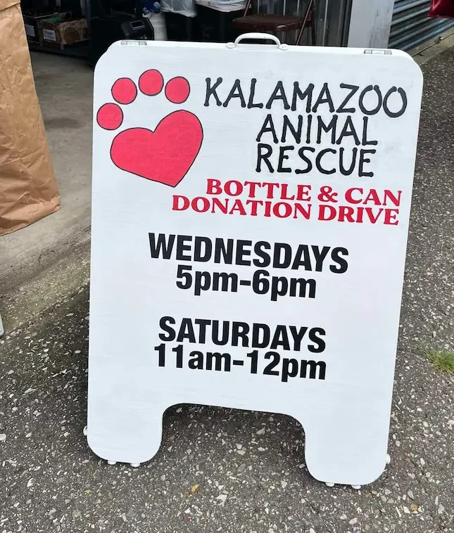 Bottle and can donation drive sign outside the storage unit